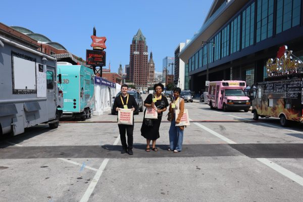 Three MATC Times staffers pose on Kilbourn Avenue on Friday afternoon as vendors set up for the RNC (Republican National Convention) July 15-18. The staffers, from left to right, are: Warren Murphy, Cierra Pleshette and Zanaia Joshua.
