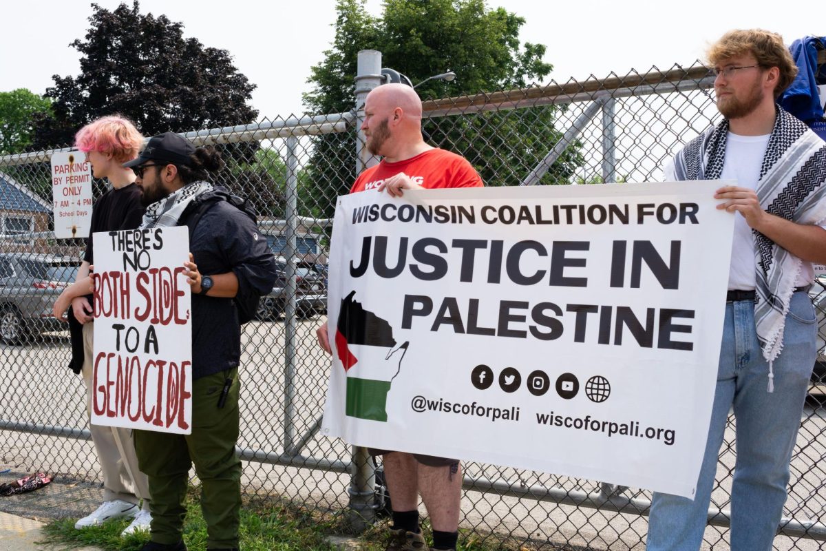 Pro Palestine protesters stand outside of West Allis Central High School in response to Vice President Kamala Harris' arrival to speak.