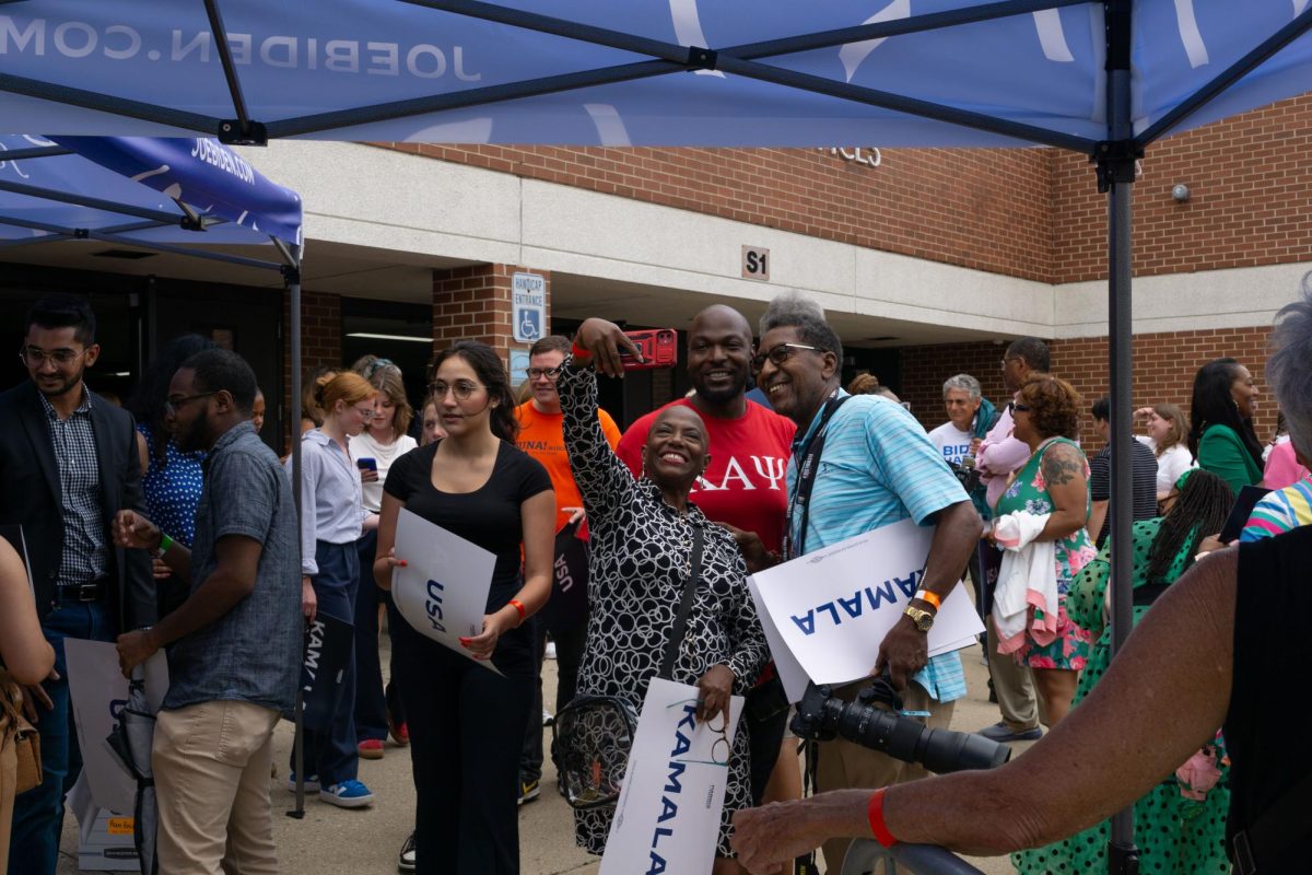 People gathering and taking photographs in excitement after Vice President Kamala Harris' speech at a high school in West Allis on Tuesday, July 23. Harris is the presumptive presidential candidate for the Democratic Party after President Biden dropped out of the race.