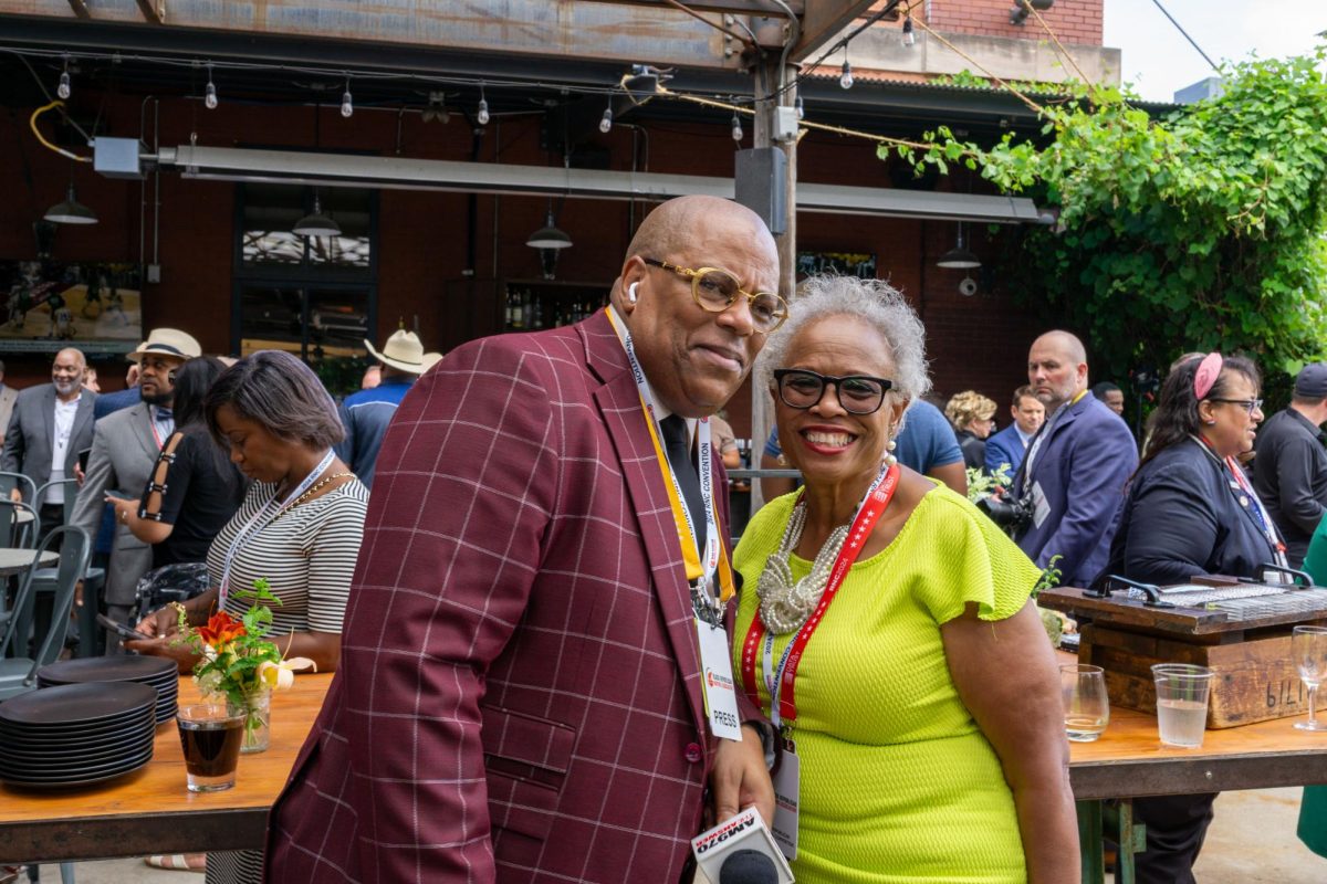 Dr Joann Fisher, Veteran and advocate for Vets, poses for a picture with a reporter for the AM 970 The Answer radio show during an event at the Iron Horse Hotel in Milwaukee during the RNC.