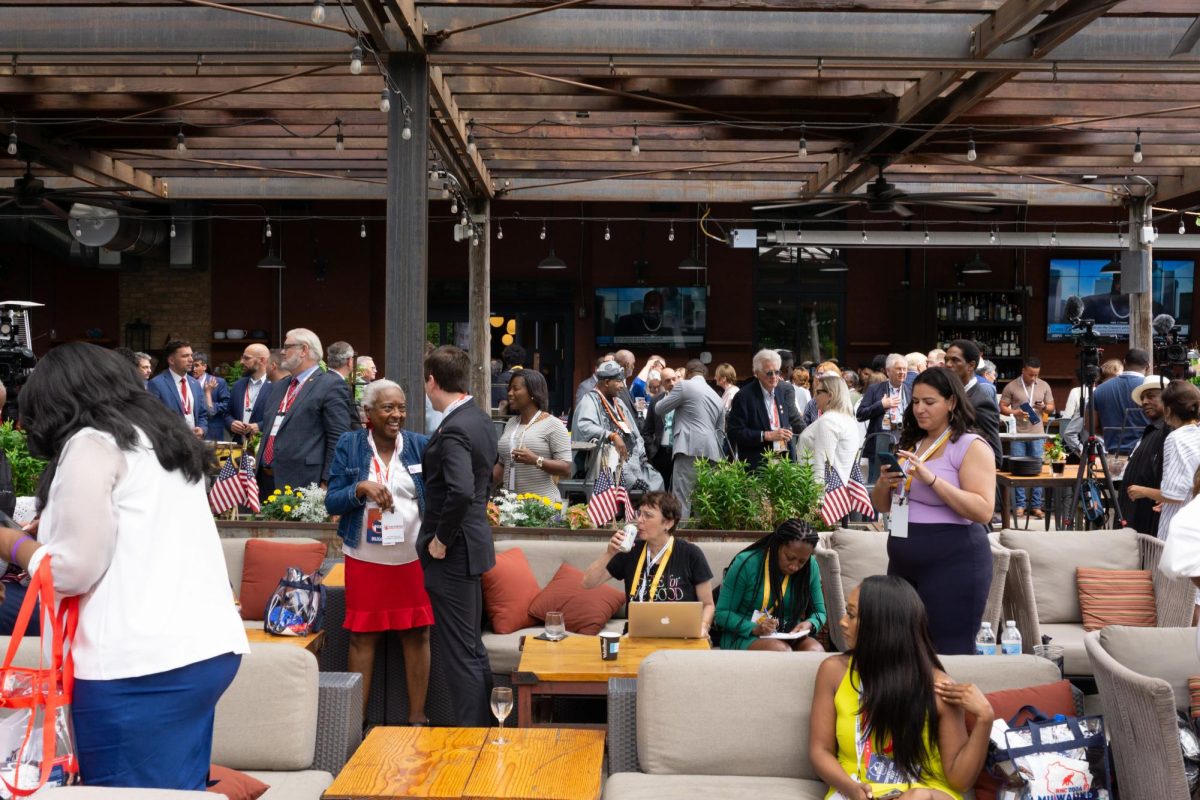 Attendees of the Black Republican Mayors Association gathering get up to mingle after speeches.