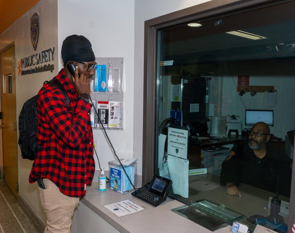 MATC Surgical Tech student Frederick Haney talks to Public Safety Officer Johnny Taylor at the Public Safety Office Downtown. Students, faculty and staff can reach out to officers with their concerns by calling, texting on the Rave Guardian App or reaching out directly like Haney is doing.