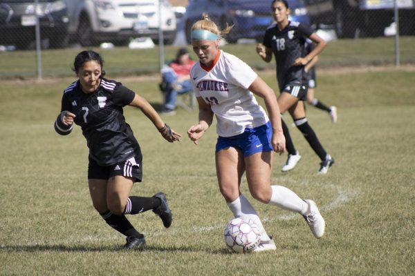 #13 Freshman Forward Katelyn Haeft dribbling the ball in the Stormers game against Triton College on September 25.