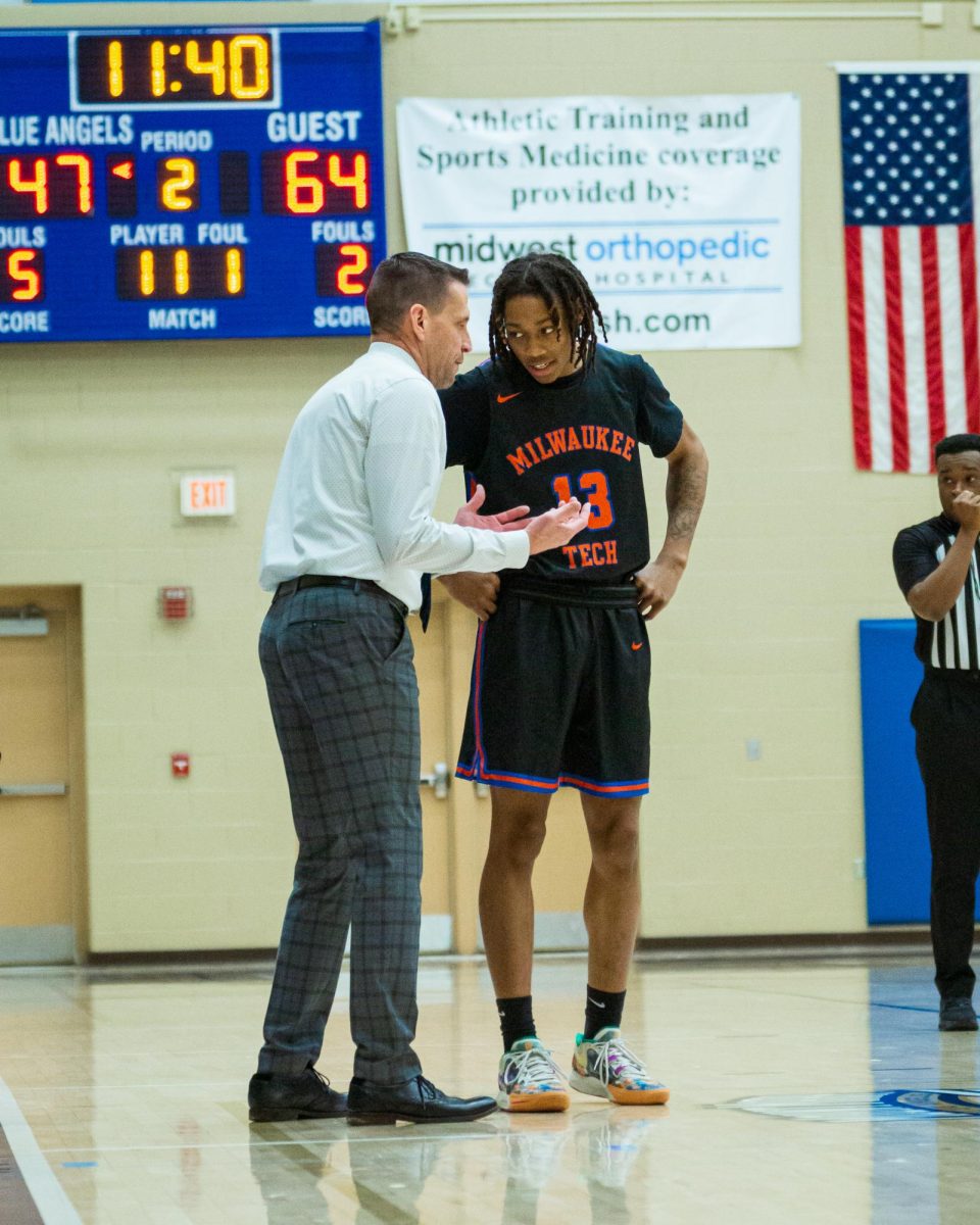 Head Men's Basketball Coach and Athletic Director Randy Casey pulls Brionne Williams aside during a free-throw to talk during a 94-73 win over Bryant and Stratton College on February 13, 2024. 