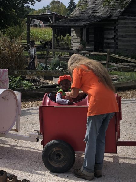 Melani Gray takes a mini train ride on her first trip to a pumpkin patch at Lindell’s Pumpkin Farm.