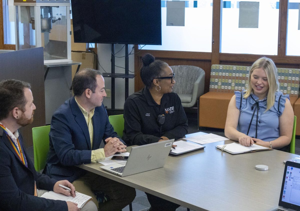 Secretary for DSA, Jenna Miles (r) speaks as MATC leaders listen. From left to right: Director of Student Life, Erich Zeimantz; Chief Marketing Officer, Tony Tagliavia; Director of Public Safety, Aisha Barkow.