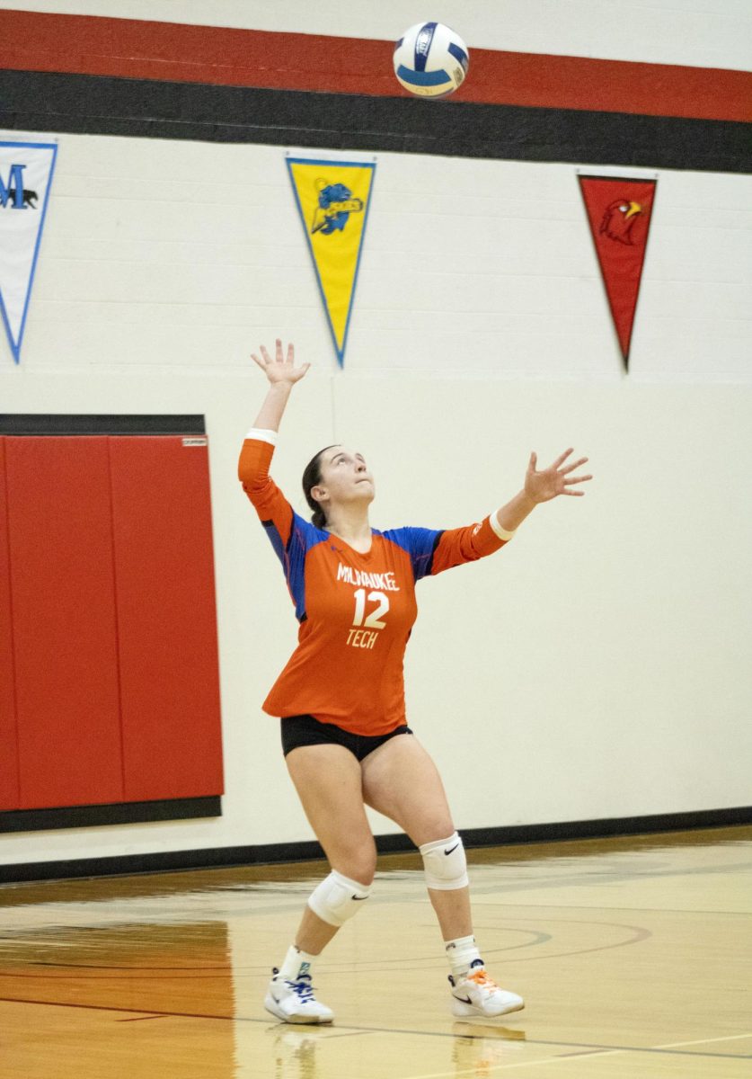 Sophomore Outside hitter/Middle Blocker #12 Paige Siehr in a match against Harper College on October 10, 2024.