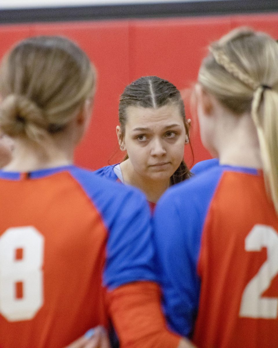 Freshman Outside Hitter #10 Rachel Krueger during a team huddle in a match against Harper College on October 10, 2024