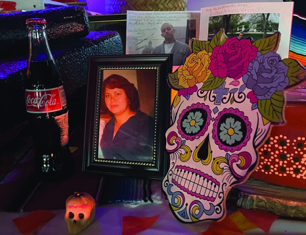 Lourdes Camacho (front) and Gilbert Luis Vazquez (back) Día de Los Muertos (Day of the Dead) memorial at El Conquistador resort. Camacho is the grandmother of MATC Times Photographer Erik Martinez. Mexican Coke, a beloved drink, sits beside her photo.