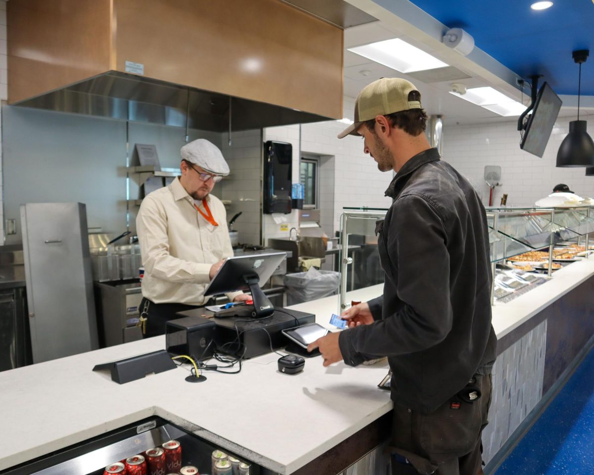 Jeremy Magestro, MATC’s Catering Coordinator, checks out a student at the cafeteria on the third floor of the S Building at the Downtown Campus. 