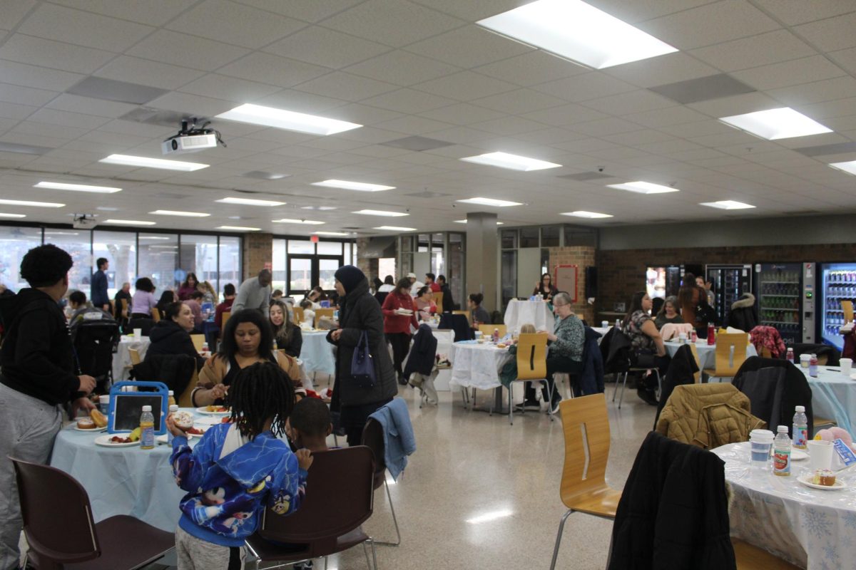 Tables full of families participate in a free event on December 7, 2024.