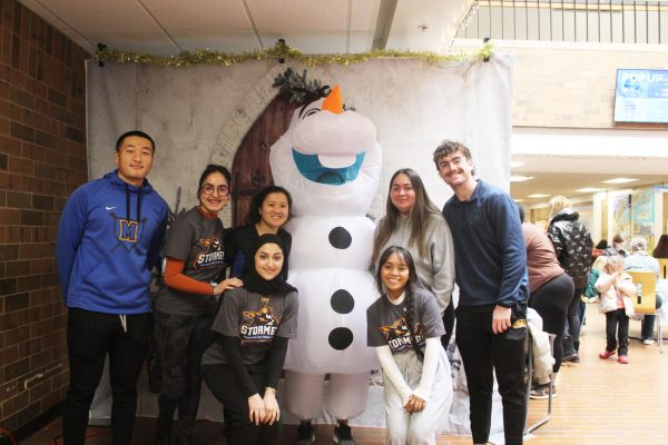 A group photo with Olaf at the Oak Creek campus on December 7, 2024