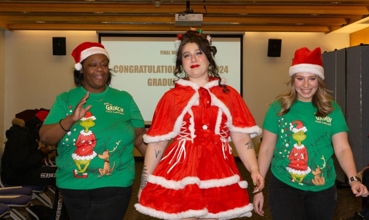 Advanced cosmetology graduates Samone Reed and Brooke Kregloski do a final walk with their model for their “ The Grinch: Martha May Whovier” theme for MATC’sThe Edge: A Beauty Showcase. December 11,2024. 