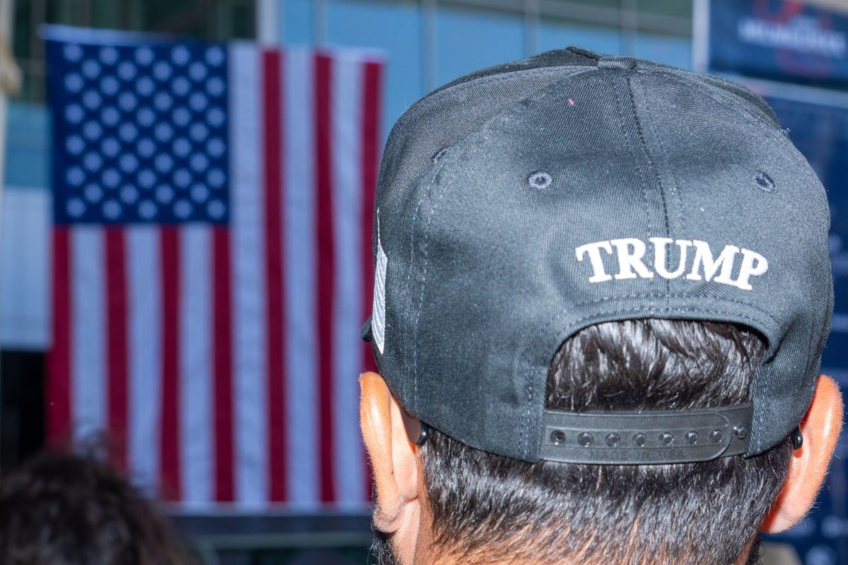 An attendee at the Republican National Convention in Milwaukee wearing a hat that shows his support for Trump on the back. July 18, 2024. Milwaukee, WI
