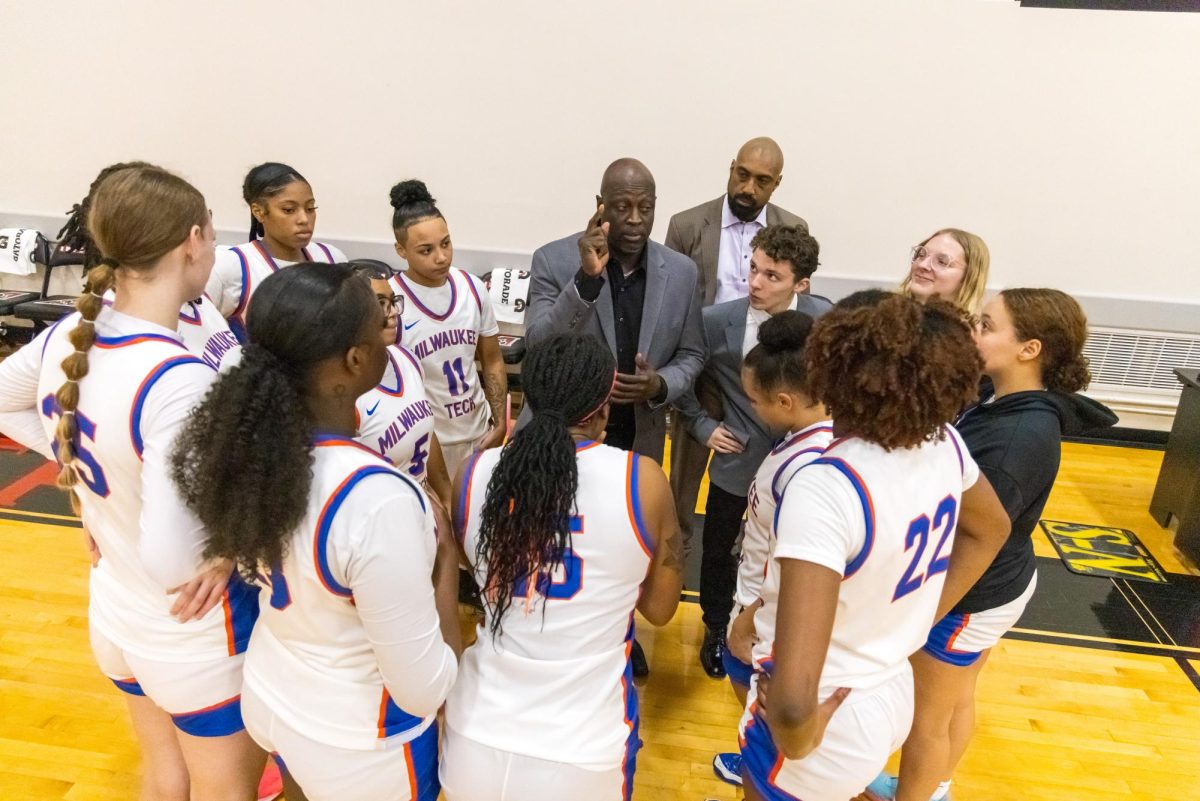 Coach Arom Murrell talks strategy with the Women’s Basketball team. Photo courtesy of Time Evans, MATC Marketing & Communications. (This photo was not taken at the Play4Kay game.)