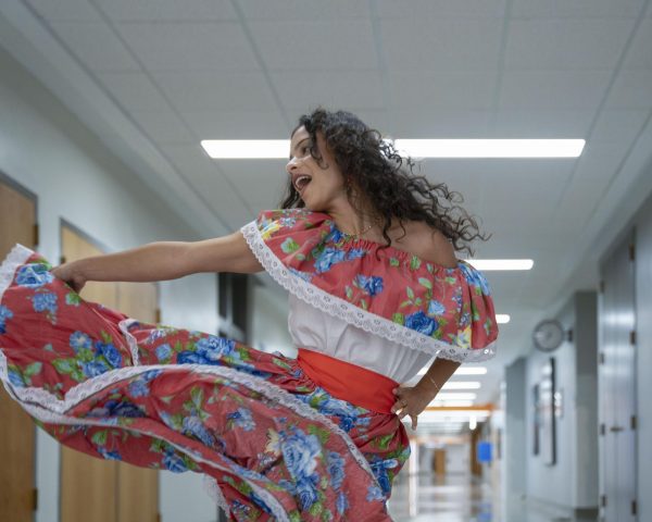 Live in the moment!- MATC student Tatiana Lugo dances in the hallways in her traditional cultural attire