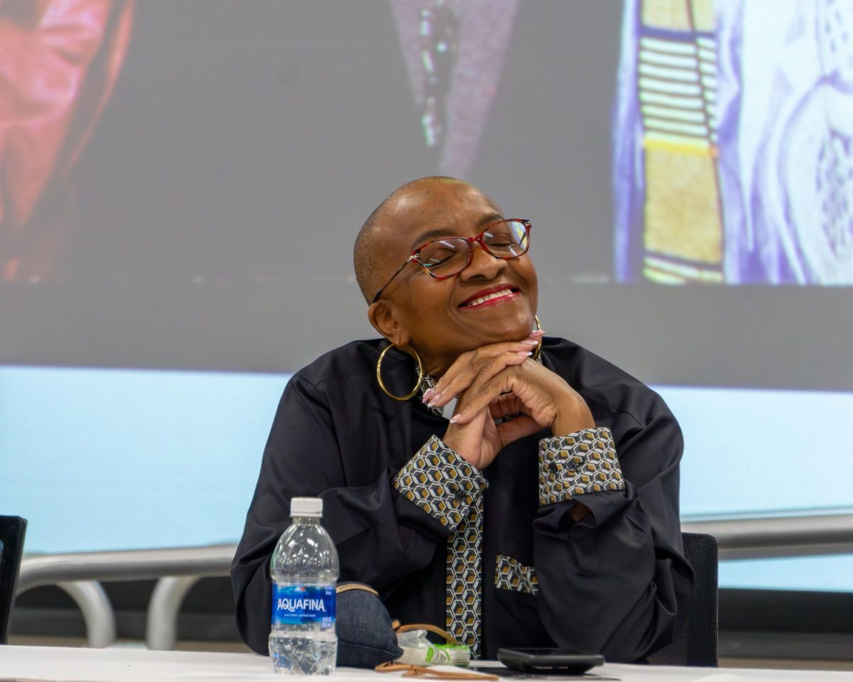 Keynote Speaker Rev. Nontombi Naomi Tutu smiles with gratitude as Dr. Sadique Isahaku introduces her during MATC’s Dr. Martin Luther King Jr. birthday celebration on January 15, 2025. 