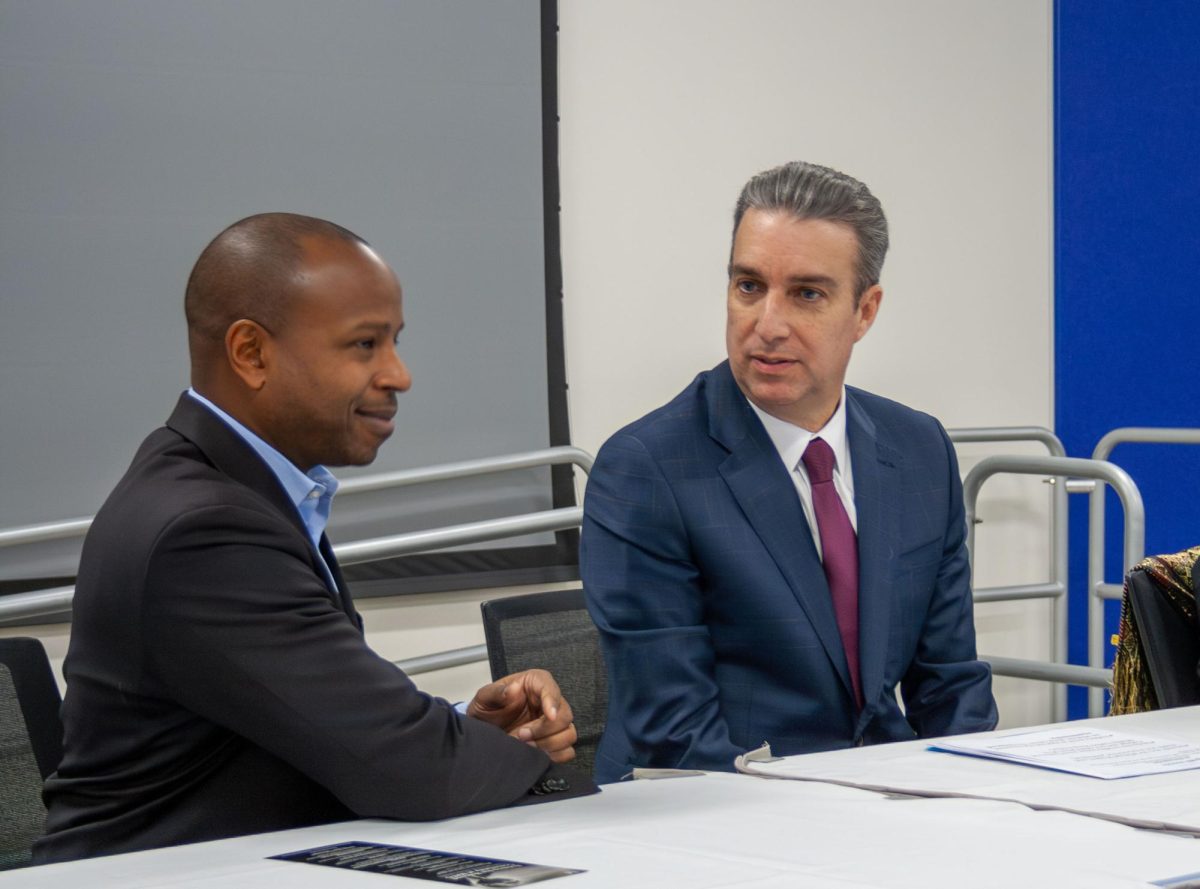 Milwaukee Mayor Cavalier Johnson (left) and MATC President Dr. Anthony Cruz engage in conversation before the start of the MATC Dr. Martin Luther King Jr. birthday celebration on January 15, 2025. 