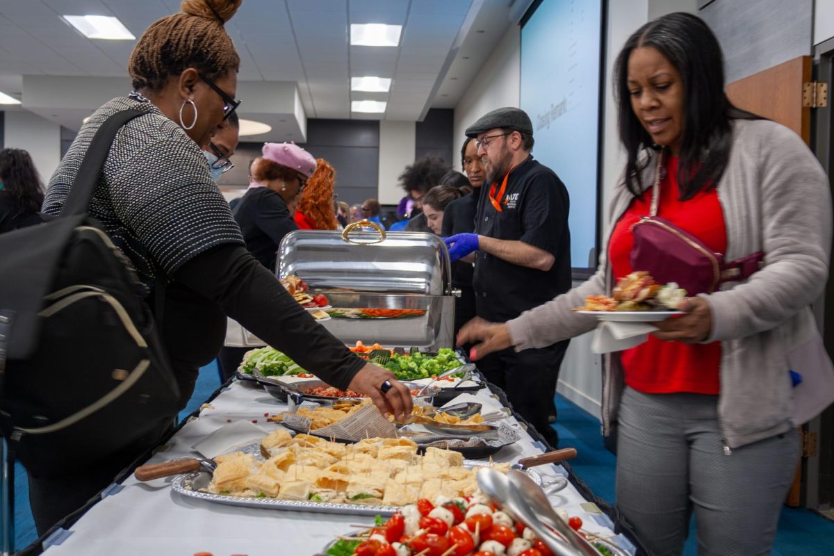 Guests enjoy light refreshments and food provided by the MATC Food and Beverages Services at the MATC Dr. Martin Luther King Jr. birthday celebration on January 15, 2025.