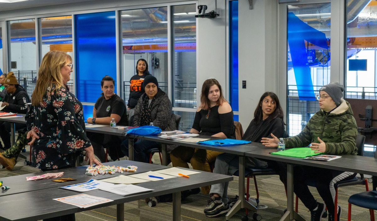 A CNC instructor listens to the hardships one of the women had to go through in the trade industry during the Manufacturing, Construction & Transportation (MCT) Pathways Labor Ladies welcoming on January 15, 2025. 