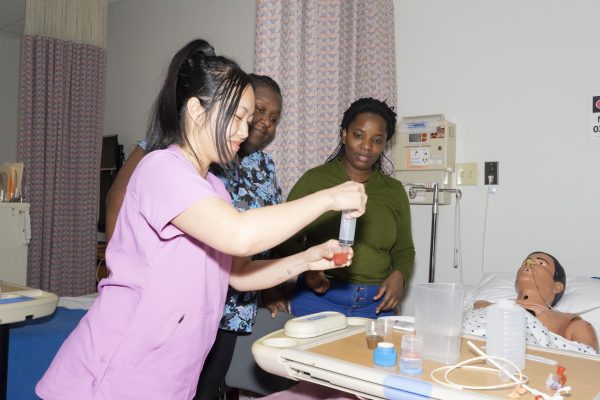 MATC students practice distributing medicine in class. 