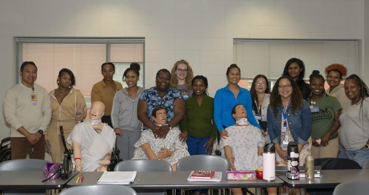 Class photo of nursing students and instructors in H-336 .

