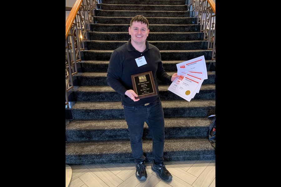 MATC Times Managing Editor Warren Murphy holds five Wisconsin Newspaper Association - Foundation Better Newspaper awards won by Iryna Levit, Jang Vuong, Warren Murphy, and the MATC Times staff after a luncheon on March 7, 2025. This photo was taken by a student photographer attending the event.