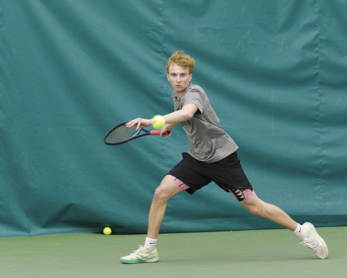 Stormers tennis player Payton Kuzminski hustles to return  the ball in a match against McHenry County College. April 6, 2025 