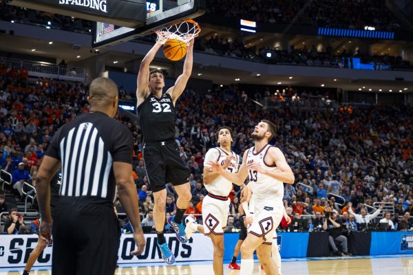 Xavier Guard Zach Freemantle throws down a dunk in an exciting matchup in the first round of the NCAA tournament at Fiserv Forum vs Illinois on Sunday March 23rd, 2025.