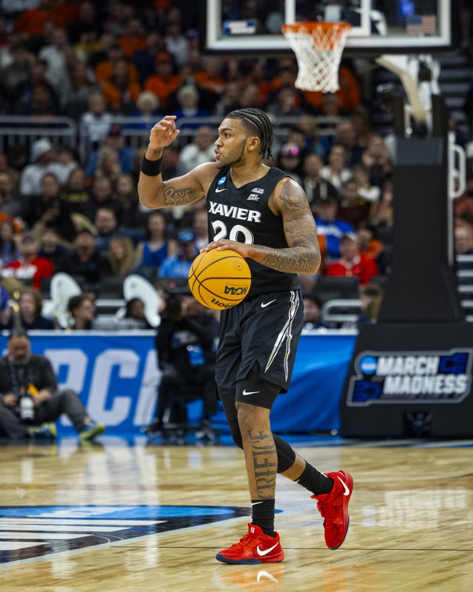 Xavier Guard Dayvion McKnight takes the ball up the ﬂoor in the first round of the NCAA tournament at Fiserv Forum vs Illinois on Sunday March 23rd, 2025.
