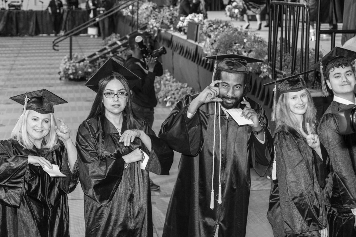 Students pose at MATC's Spring 2025 commencement ceremony.