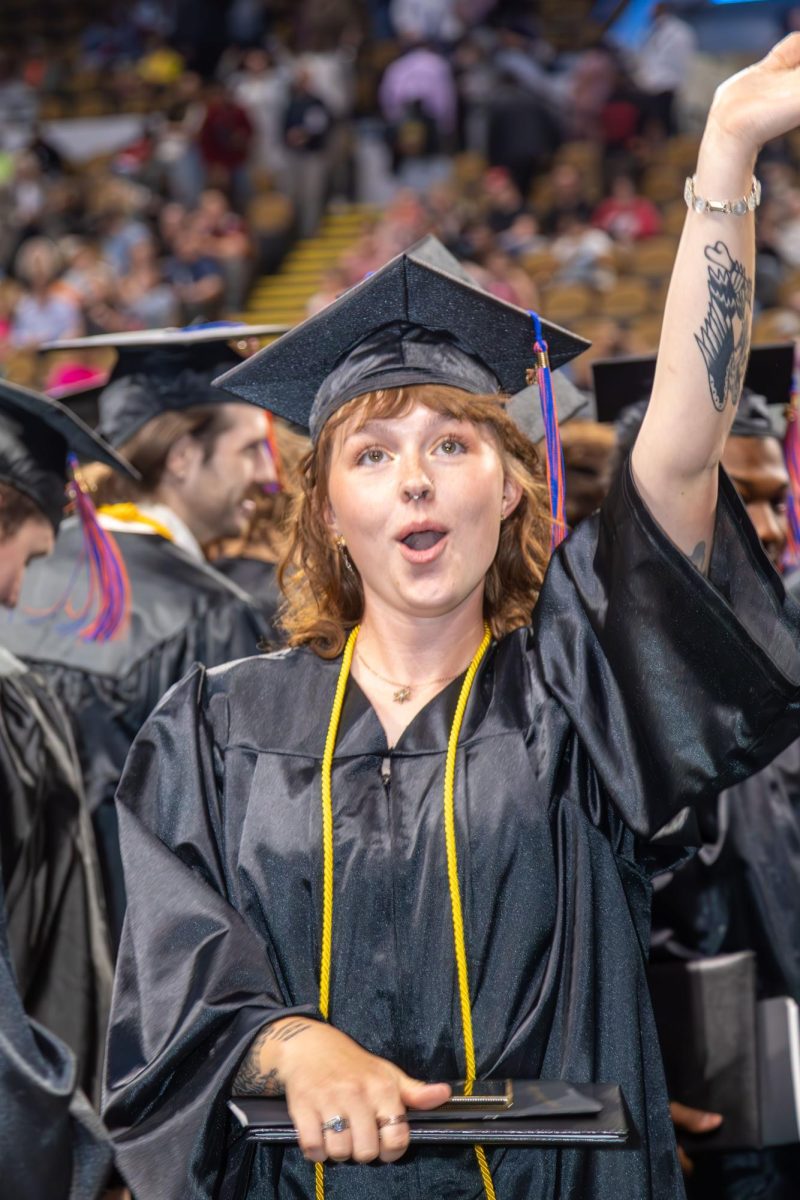 A graduate expresses her excitement at MATC's Spring Commencement ceremony.
