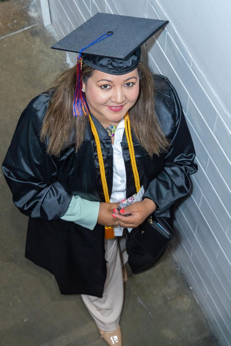 A graduate is all smiles at MATC's Spring Commencement.