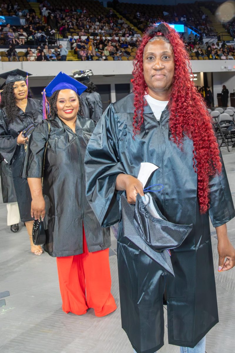 Graduates smile at MATC's Spring 2025 commencement ceremony.