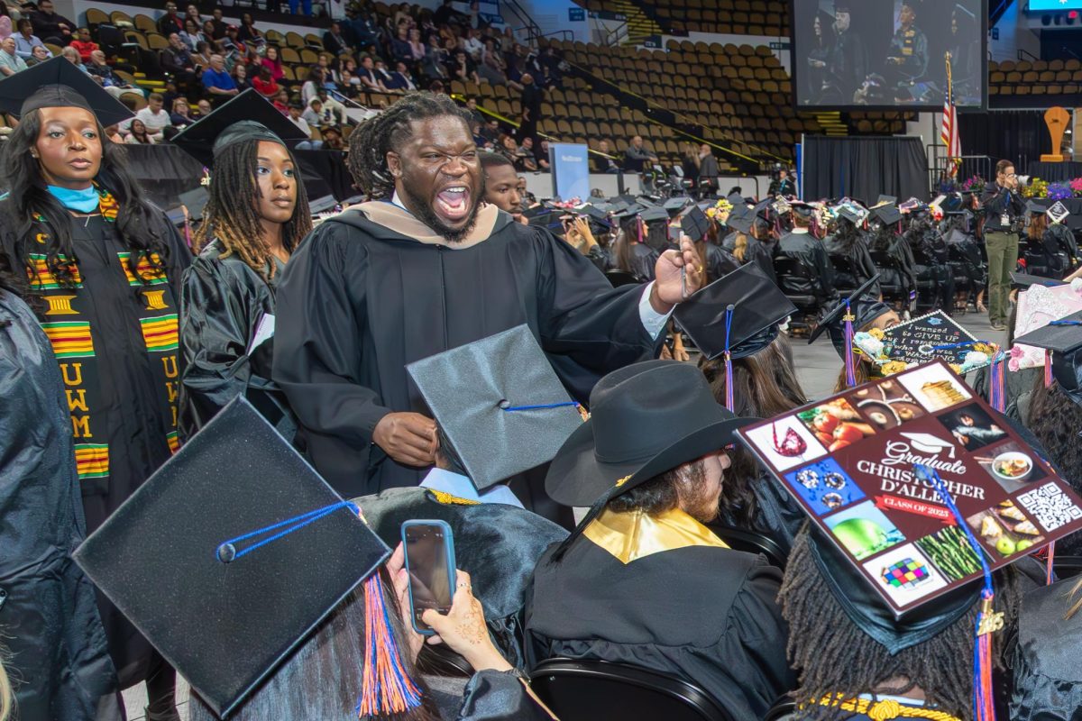Student Success Dean, Equan Burrows shows his excitement at MATC's 2025 Spring Commencement ceremony.