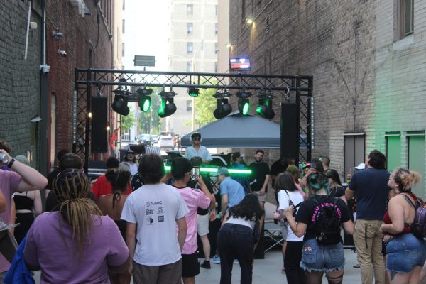 People gather for a performance at the Milwaukee Downtown Market on June 11.
