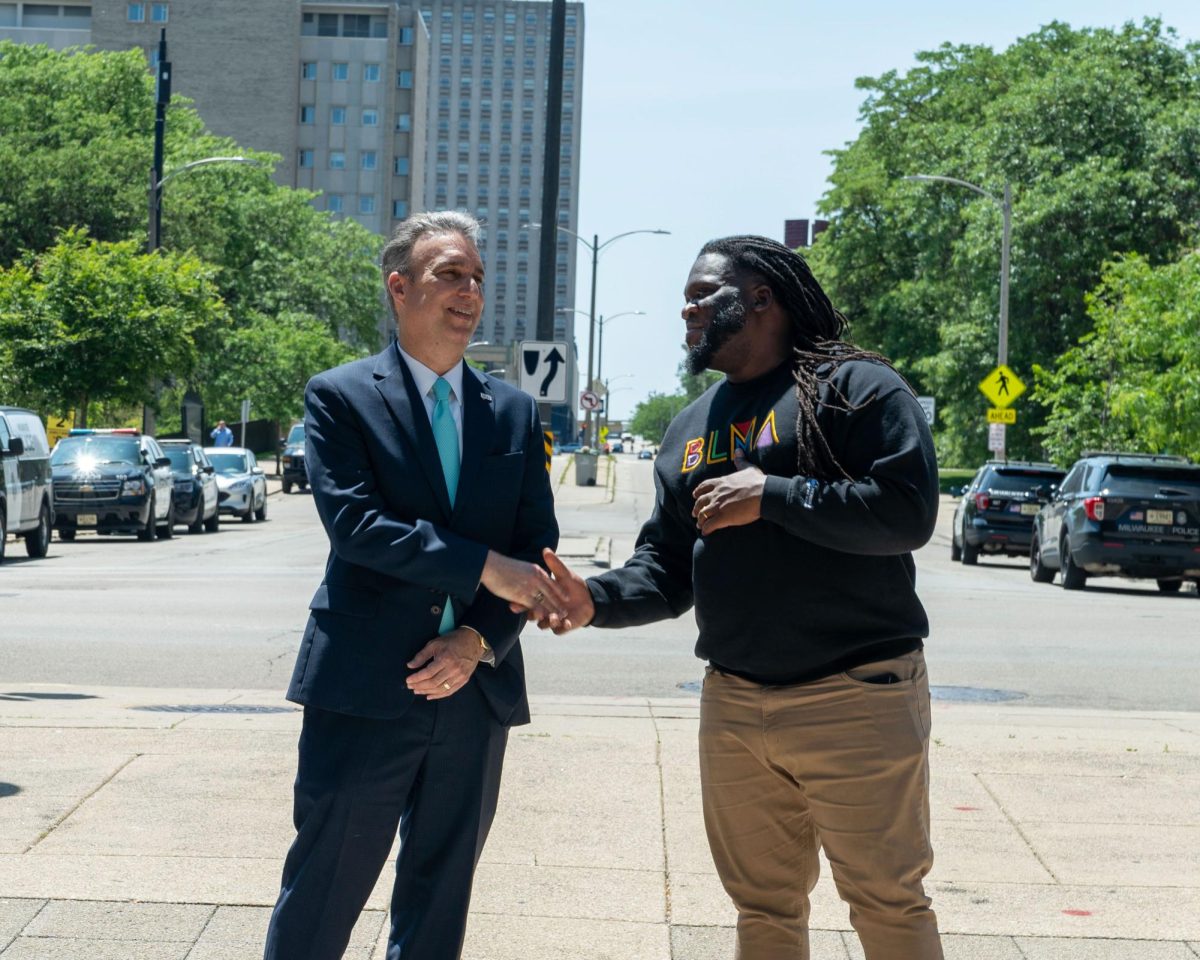 President Anthony Cruz and Equan Burrows, Dean of Student Experience shake hands during the Juneteenth Flag Raise Ceremony on Tuesday, June 17,2025

