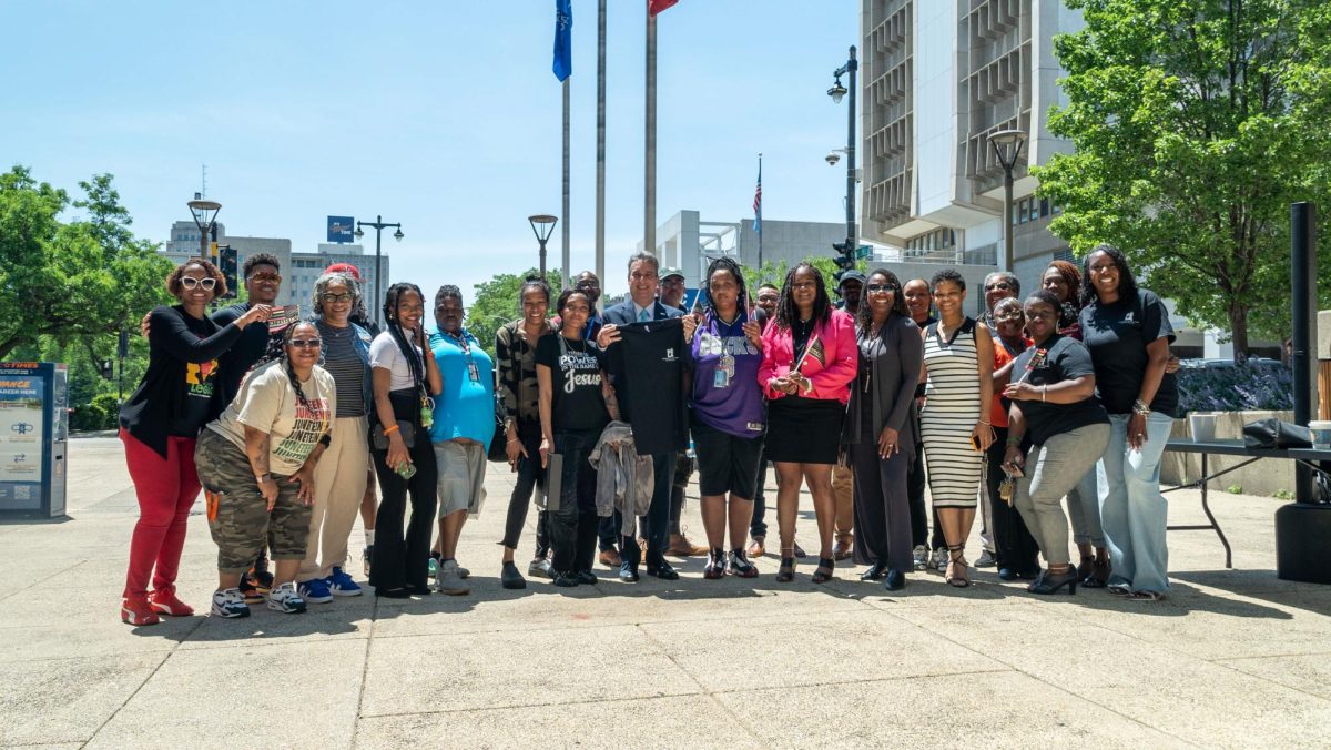 Representatives of the Black Excellence Leadership Alliance, the Juneteenth Parade Committee, students and President Anthony Cruz during the celebration of the Juneteenth Flag Raising Ceremony outside of the Student Building, Downtown Campus. Tuesday, June 17, 2025. 