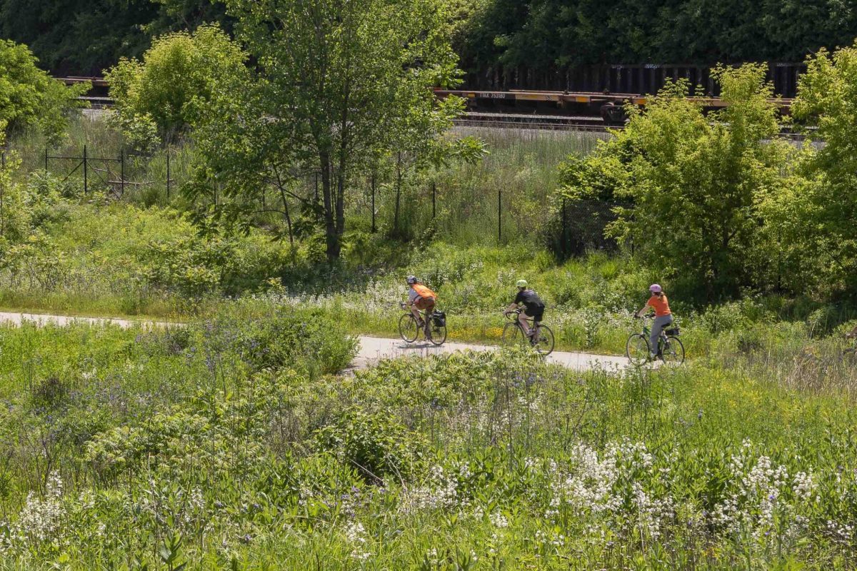Bike riders enjoy Three Bridges Park in the Menomonee River Valley.