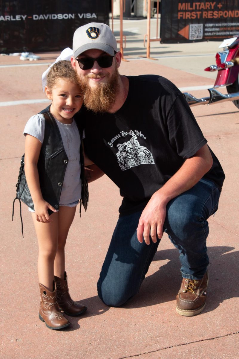 A father and daughter pose at the 2025 Harley-Davidson Homecoming Festival, July 10-13.