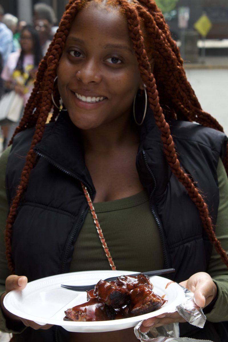 A student is all smiles after receiving free food at MATC's Downton Campus.