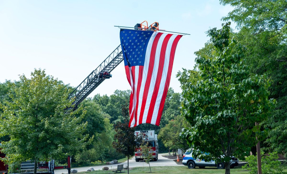 The American flag raised as a beacon of hope, strength and unity during the 9/11 ceremony at the Oak Creek campus. 