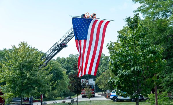 The American flag raised as a beacon of hope, strength and unity during the 9/11 ceremony at the Oak Creek campus. 