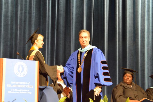 MATC President Dr. Anthony Cruz walks across the stage at today's investiture ceremony. 