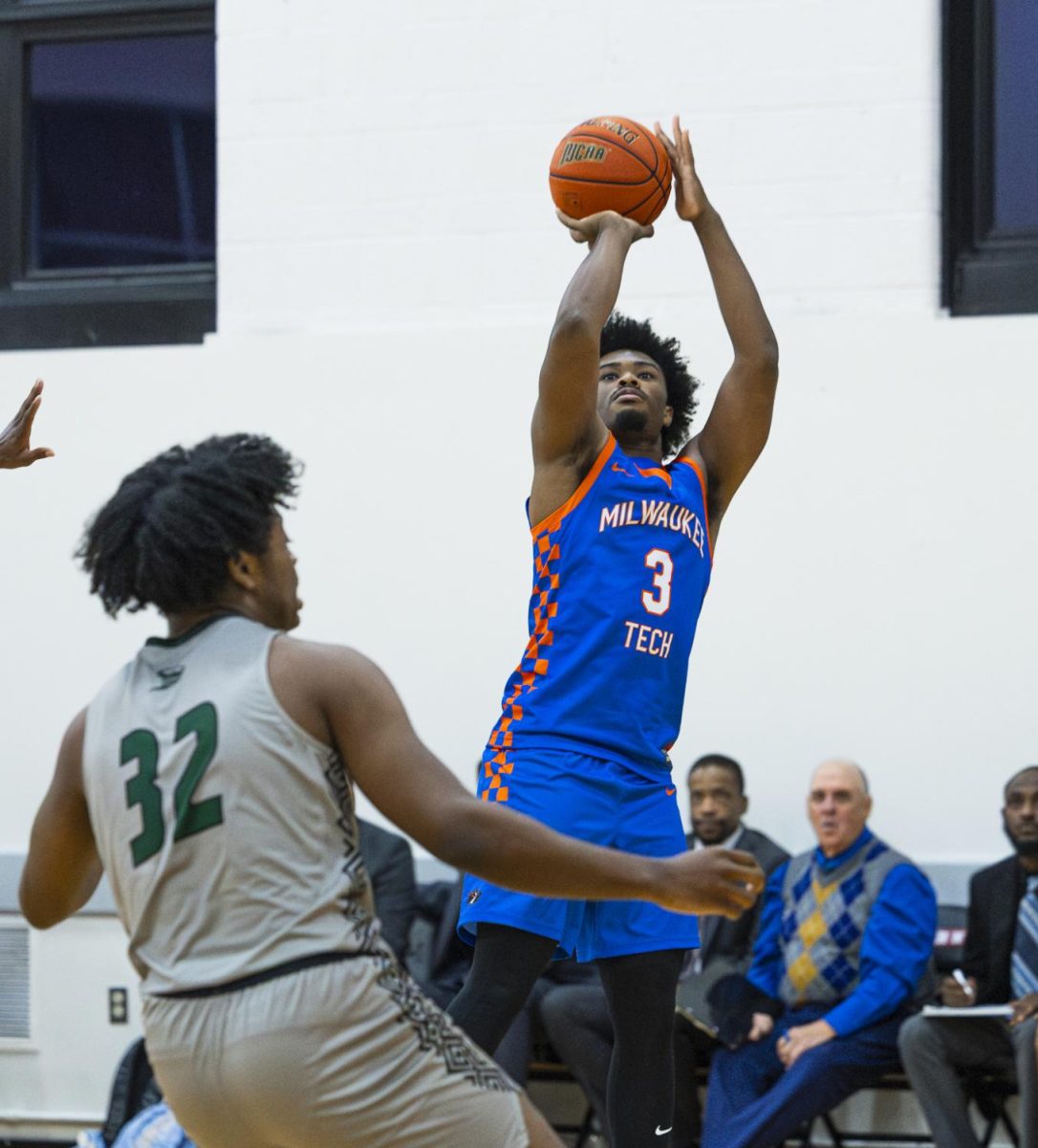 Kamarion Ivory takes a jump shot over his opponent in the game against Moraine Valley Community College on November 9. 