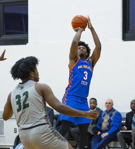 Kamarion Ivory takes a jump shot over his opponent in the game against Moraine Valley Community College on November 9. 