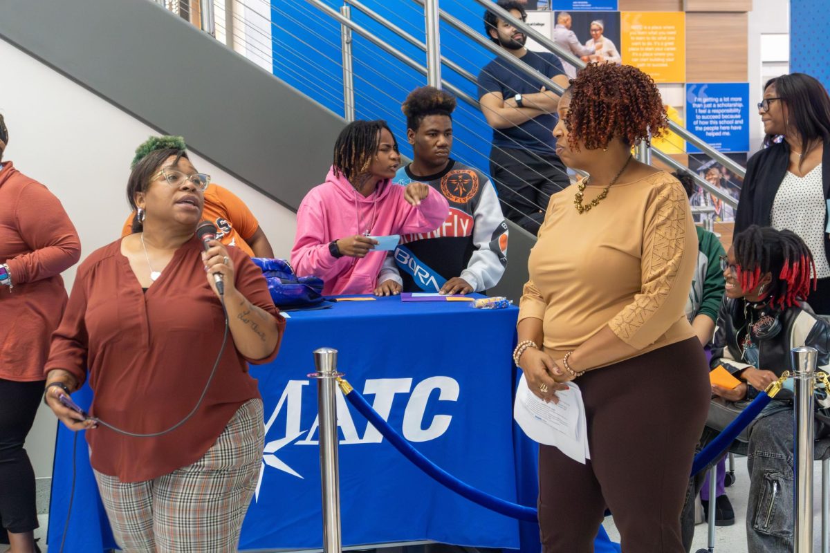 Students and staff gather on the first floor of the S Building at the Downtown Campus for a CareerHub event to show students what they should and shouldn't wear at the upcoming career and internship fairs.