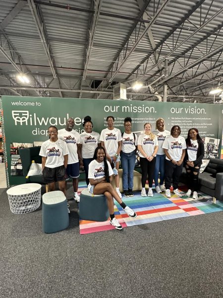 Members of the Stormers women's basketball team pose for a photo in a Cudahy warehouse after volunteering at the Milwaukee Diaper Mission. Photo shared by MATC Athletics.