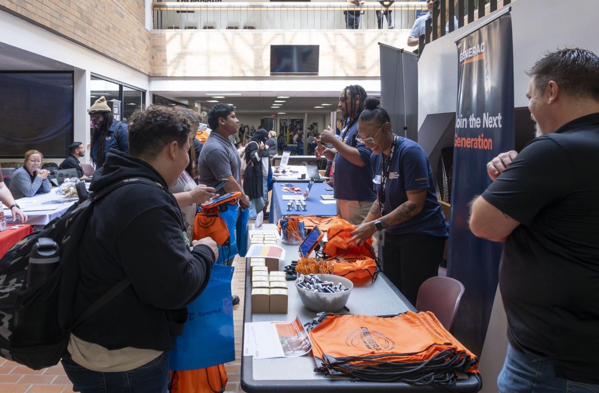 Employers answer questions at a career & internship fair at the Oak Creek Campus.
