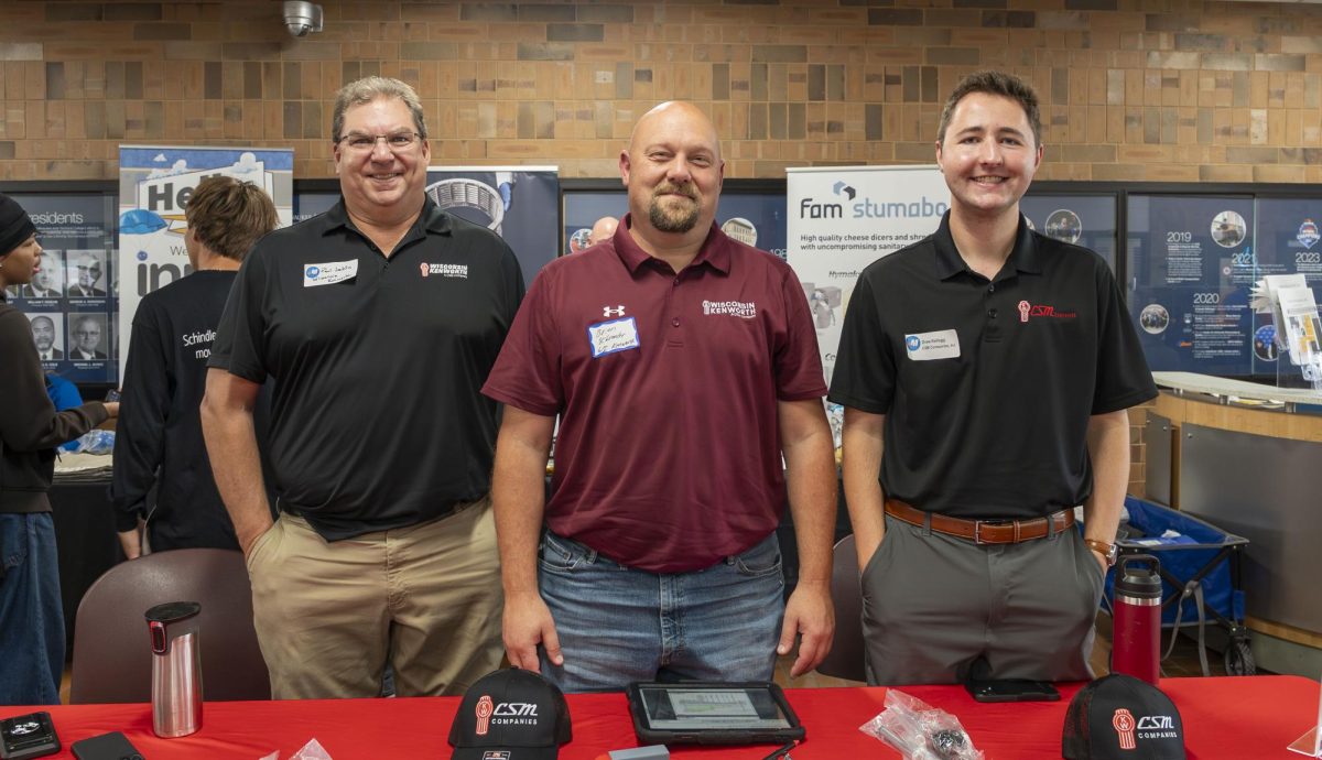 Smiling employers pose for a photo at a career & internship fair at MATC's Oak Creek Campus on Wednesday, September 24.